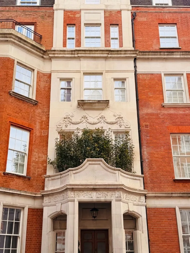The red-brick and stone facade of a residence on Mount Street, Mayfair