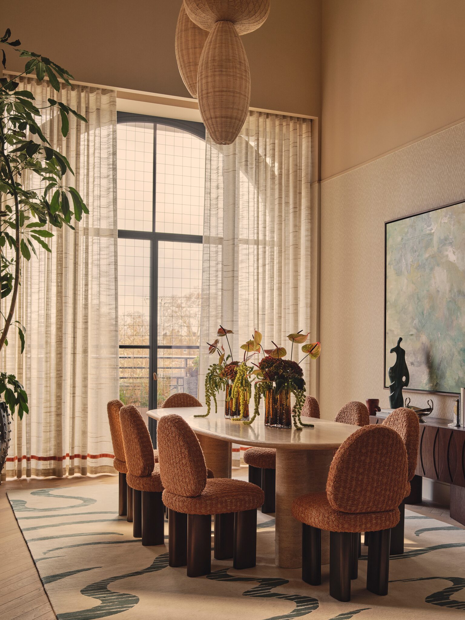 Dining area beside full-height windows at The Whiteley, Queensway