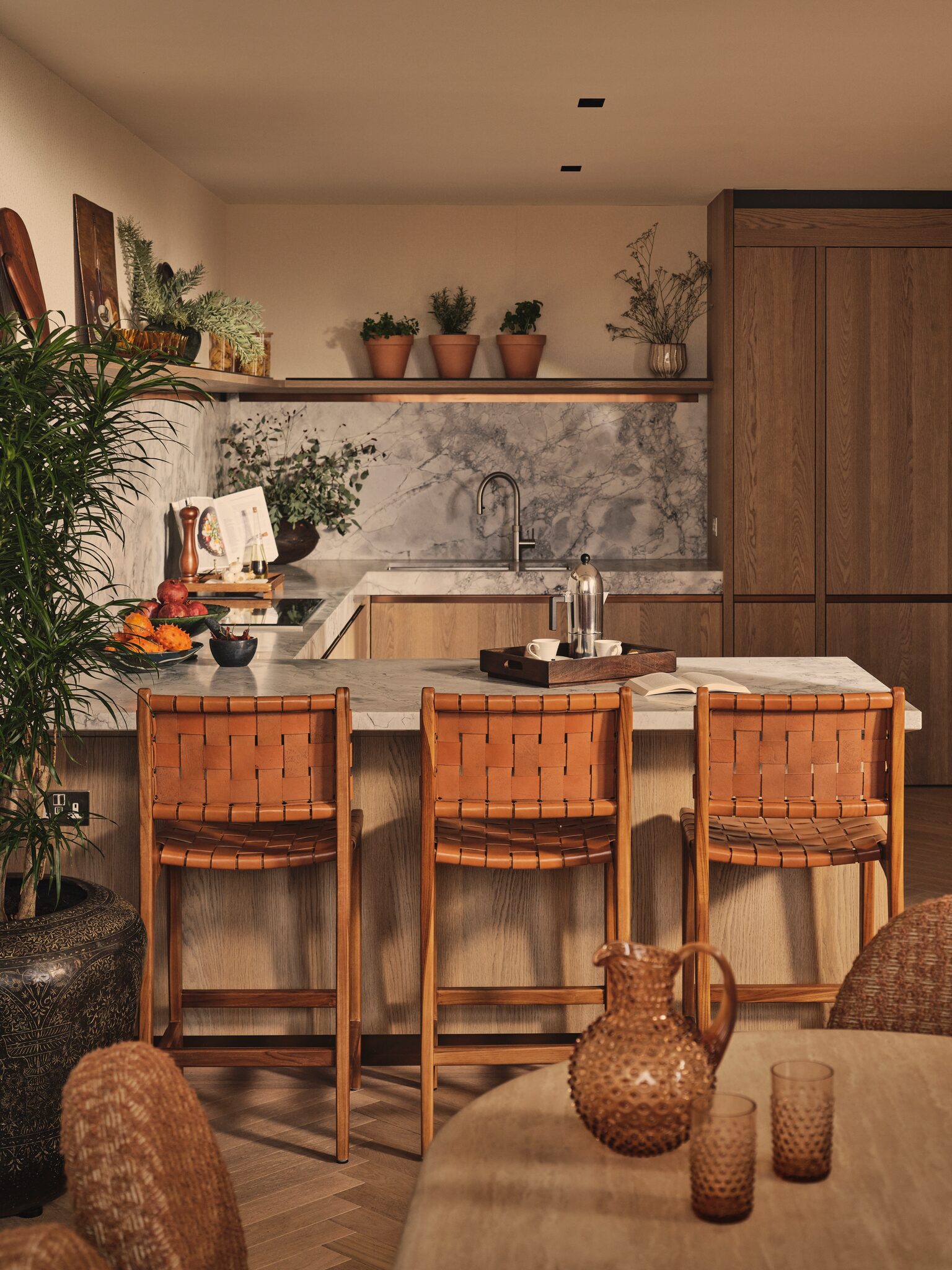 Kitchen island with bar stools at The Whiteley, Queensway