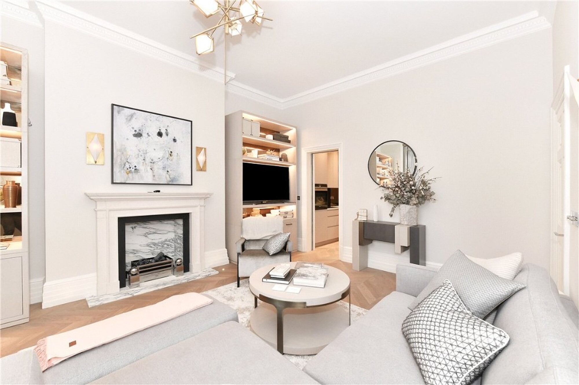 Bright Mayfair living room with marble fireplace, grey sofa and herringbone floor on Mount Street